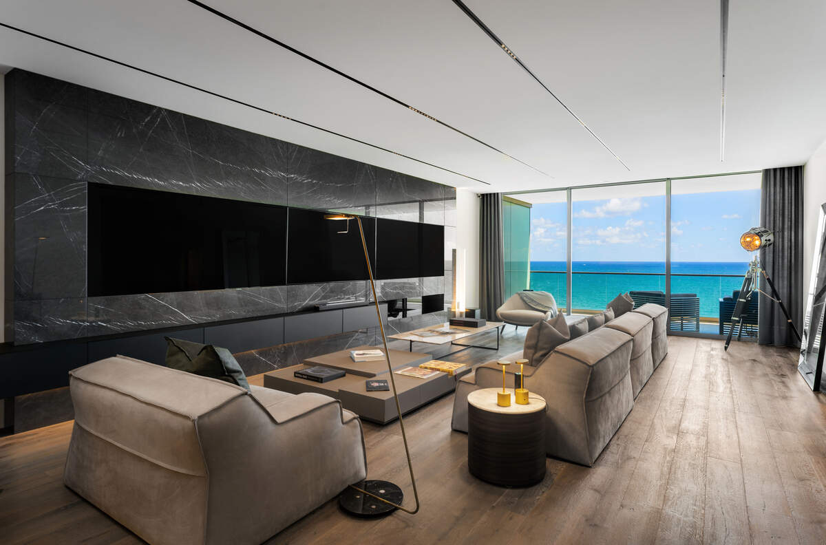 A living room in retired Brazilian soccer player Kaká’s new Bal Harbour condo has views of the Atlantic Ocean.
